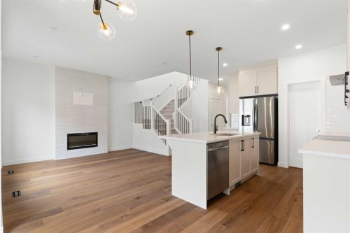 107 Heritage Manor, Cochrane, AB - Indoor Photo Showing Kitchen With Upgraded Kitchen