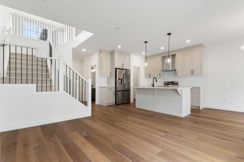107 Heritage Manor, Cochrane, AB - Indoor Photo Showing Kitchen With Upgraded Kitchen