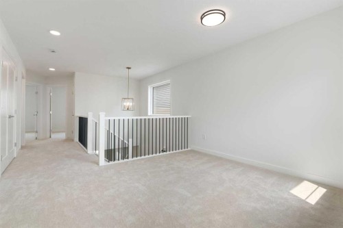 107 Heritage Manor, Cochrane, AB - Indoor Photo Showing Other Room