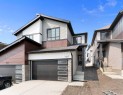 107 Heritage Manor, Cochrane, AB  - Outdoor With Facade 