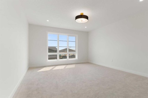 107 Heritage Manor, Cochrane, AB - Indoor Photo Showing Other Room