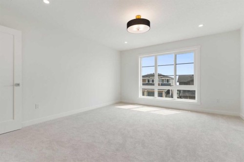 107 Heritage Manor, Cochrane, AB - Indoor Photo Showing Other Room