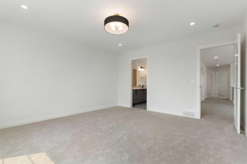 107 Heritage Manor, Cochrane, AB - Indoor Photo Showing Other Room