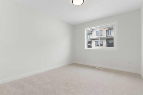 107 Heritage Manor, Cochrane, AB - Indoor Photo Showing Other Room