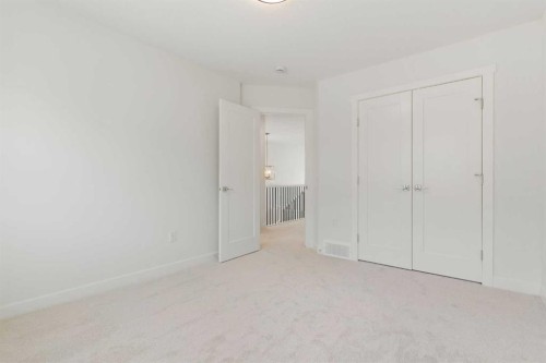107 Heritage Manor, Cochrane, AB - Indoor Photo Showing Other Room