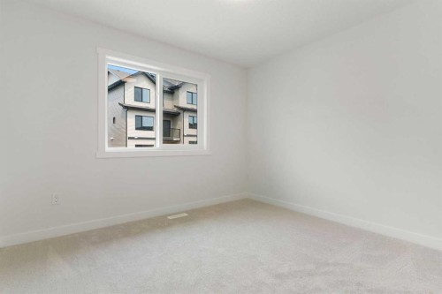 107 Heritage Manor, Cochrane, AB - Indoor Photo Showing Other Room