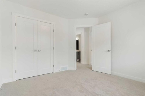 107 Heritage Manor, Cochrane, AB - Indoor Photo Showing Other Room
