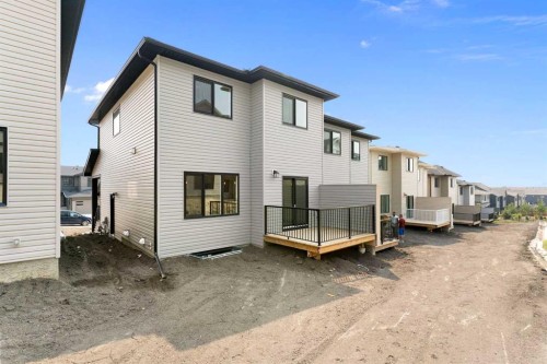 107 Heritage Manor, Cochrane, AB - Outdoor With Exterior