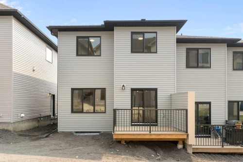 107 Heritage Manor, Cochrane, AB - Outdoor With Exterior