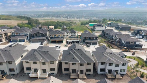 107 Heritage Manor, Cochrane, AB - Outdoor With Facade With View