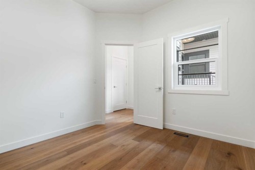 107 Heritage Manor, Cochrane, AB - Indoor Photo Showing Other Room