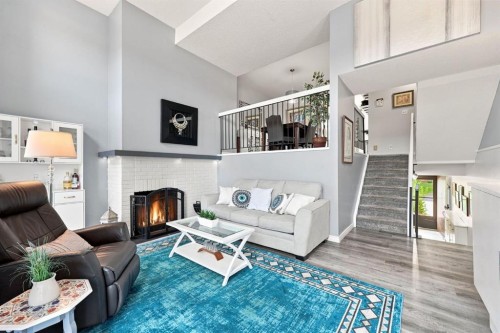 20-8533 Silver Springs Road Nw, Calgary, AB - Indoor Photo Showing Other Room With Fireplace