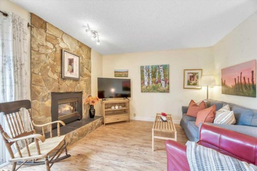 168 Midpark Gardens Se, Calgary, AB - Indoor Photo Showing Living Room With Fireplace
