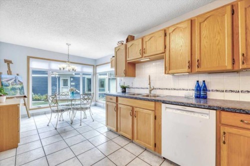 168 Midpark Gardens Se, Calgary, AB - Indoor Photo Showing Kitchen With Double Sink