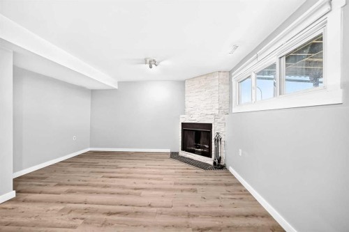 74 Fonda Drive Se, Calgary, AB - Indoor With Fireplace