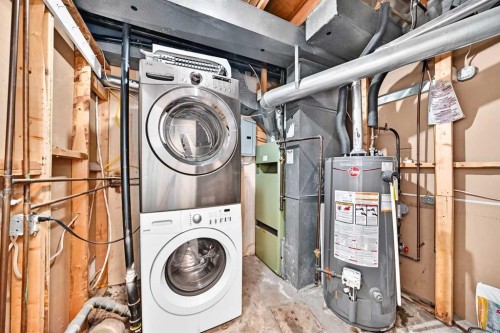 74 Fonda Drive Se, Calgary, AB - Indoor Photo Showing Laundry Room