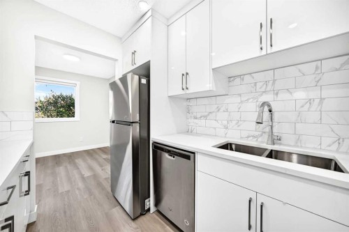 74 Fonda Drive Se, Calgary, AB - Indoor Photo Showing Kitchen With Stainless Steel Kitchen With Double Sink