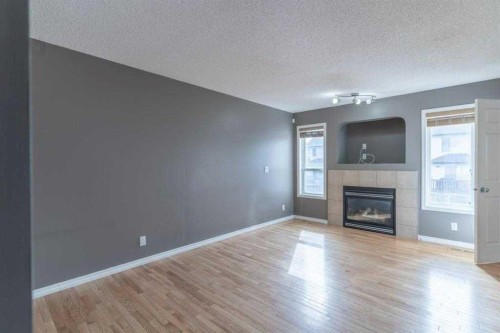 57 Royal Birch Crescent Nw, Calgary, AB - Indoor Photo Showing Living Room With Fireplace