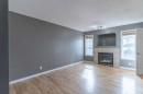 57 Royal Birch Crescent Nw, Calgary, AB  - Indoor Photo Showing Living Room With Fireplace 