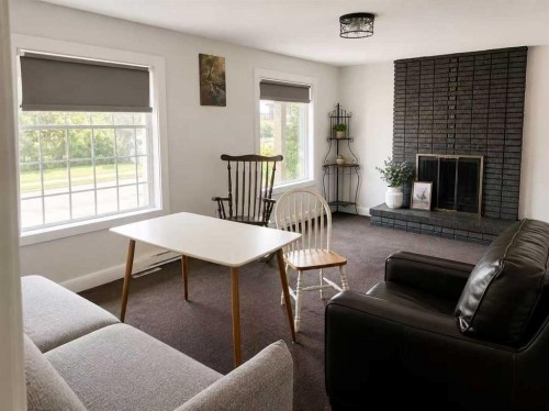 904 73 Avenue Sw, Calgary, AB - Indoor Photo Showing Living Room With Fireplace