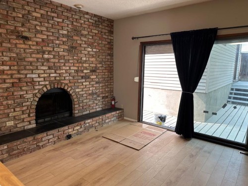 7826 Ranchview Drive Nw, Calgary, AB - Indoor With Fireplace