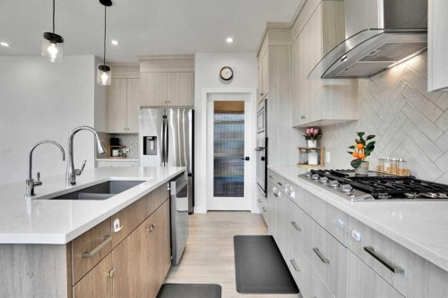 45 Dawson Gardens, Chestermere, AB - Indoor Photo Showing Kitchen With Double Sink With Upgraded Kitchen