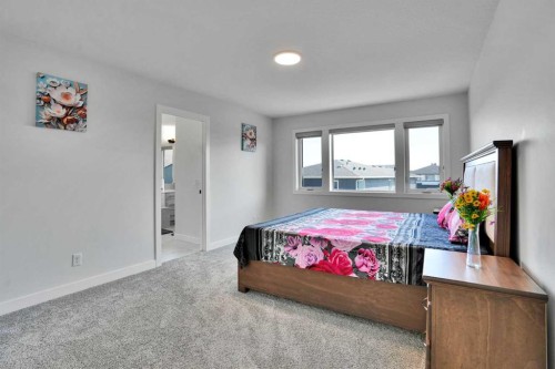 45 Dawson Gardens, Chestermere, AB - Indoor Photo Showing Bedroom