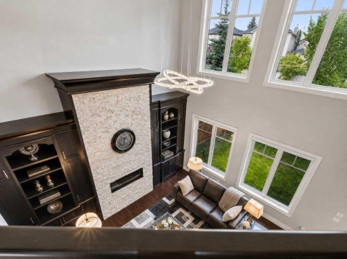 123 Aspen Summit Heath Sw, Calgary, AB - Indoor With Fireplace