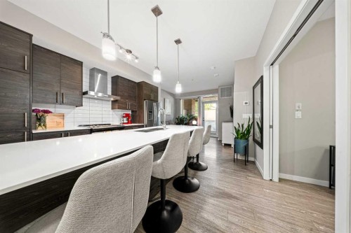 105-2231 Mahogany Boulevard Se, Calgary, AB - Indoor Photo Showing Kitchen With Upgraded Kitchen