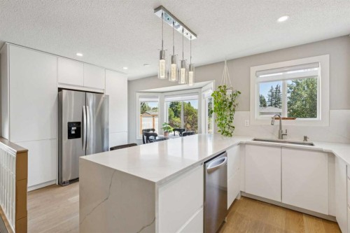 1208 Ranchlands Boulevard Nw, Calgary, AB - Indoor Photo Showing Kitchen With Stainless Steel Kitchen With Upgraded Kitchen
