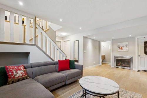1208 Ranchlands Boulevard Nw, Calgary, AB - Indoor Photo Showing Living Room With Fireplace