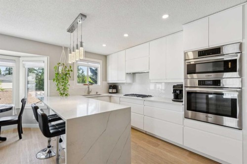 1208 Ranchlands Boulevard Nw, Calgary, AB - Indoor Photo Showing Kitchen With Stainless Steel Kitchen With Upgraded Kitchen