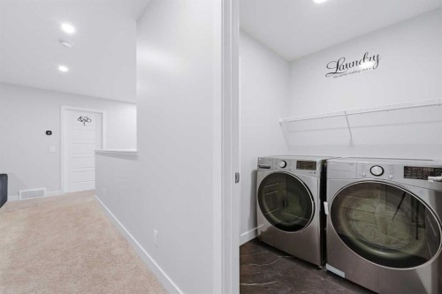 51 Setonstone Row Se, Calgary, AB - Indoor Photo Showing Laundry Room