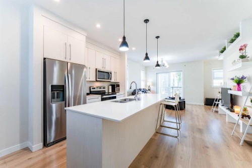 402-72 Cornerstone Manor Ne, Calgary, AB - Indoor Photo Showing Kitchen With Double Sink With Upgraded Kitchen