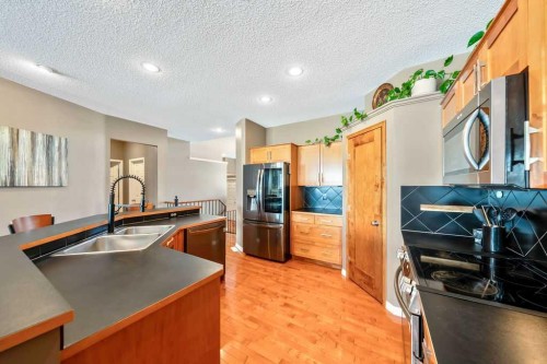 418 Bridlecreek Green Sw, Calgary, AB - Indoor Photo Showing Kitchen With Stainless Steel Kitchen With Double Sink