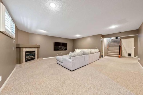418 Bridlecreek Green Sw, Calgary, AB - Indoor With Fireplace