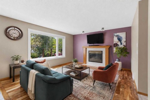 142 Riverview Circle Se, Calgary, AB - Indoor Photo Showing Living Room With Fireplace