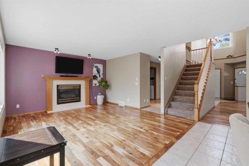 142 Riverview Circle Se, Calgary, AB - Indoor Photo Showing Living Room With Fireplace