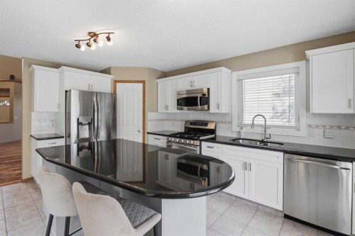 142 Riverview Circle Se, Calgary, AB - Indoor Photo Showing Kitchen With Stainless Steel Kitchen With Double Sink