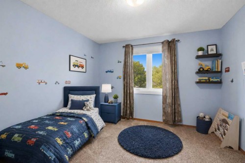 142 Riverview Circle Se, Calgary, AB - Indoor Photo Showing Bedroom