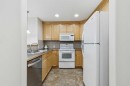 705-1726 14 Avenue Nw, Calgary, AB  - Indoor Photo Showing Kitchen With Double Sink 