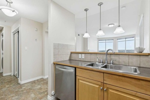 705-1726 14 Avenue Nw, Calgary, AB - Indoor Photo Showing Kitchen With Double Sink