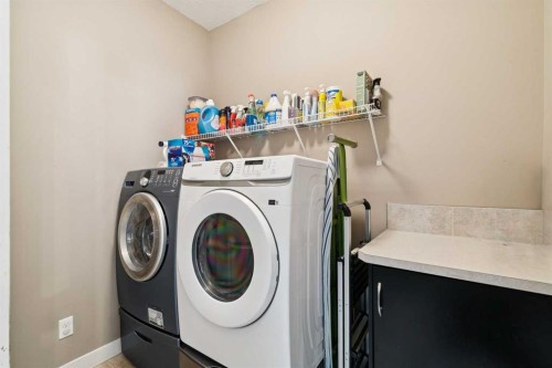 105 Bridlerange Place Sw, Calgary, AB - Indoor Photo Showing Laundry Room