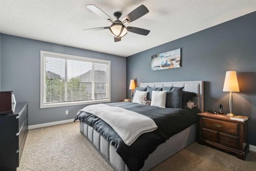 105 Bridlerange Place Sw, Calgary, AB - Indoor Photo Showing Bedroom