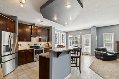 105 Bridlerange Place Sw, Calgary, AB - Indoor Photo Showing Kitchen With Stainless Steel Kitchen With Upgraded Kitchen