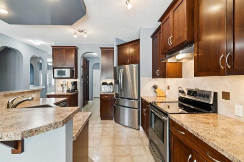 105 Bridlerange Place Sw, Calgary, AB - Indoor Photo Showing Kitchen With Stainless Steel Kitchen With Upgraded Kitchen