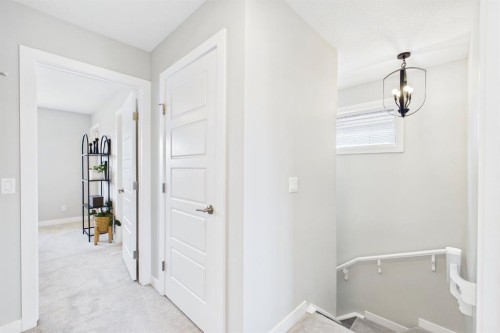 31 Sundown Manor, Cochrane, AB - Indoor Photo Showing Other Room