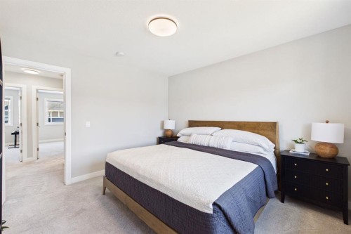31 Sundown Manor, Cochrane, AB - Indoor Photo Showing Bedroom