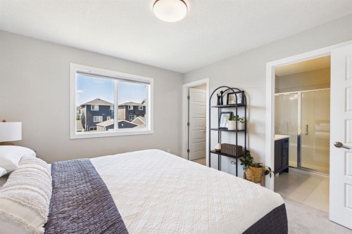 31 Sundown Manor, Cochrane, AB - Indoor Photo Showing Bedroom