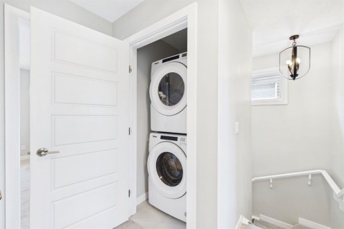 31 Sundown Manor, Cochrane, AB - Indoor Photo Showing Laundry Room